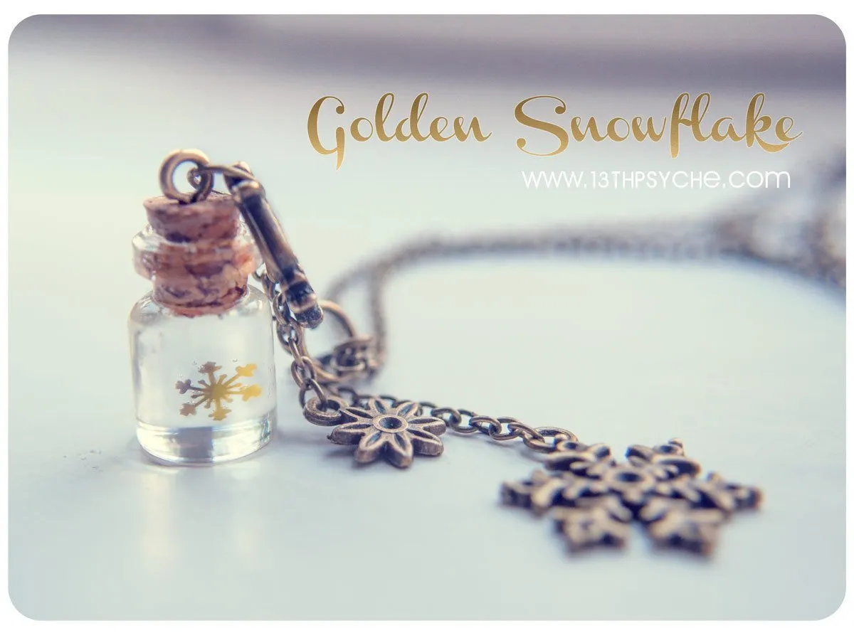 Golden snowflake glass bottle pendant necklace